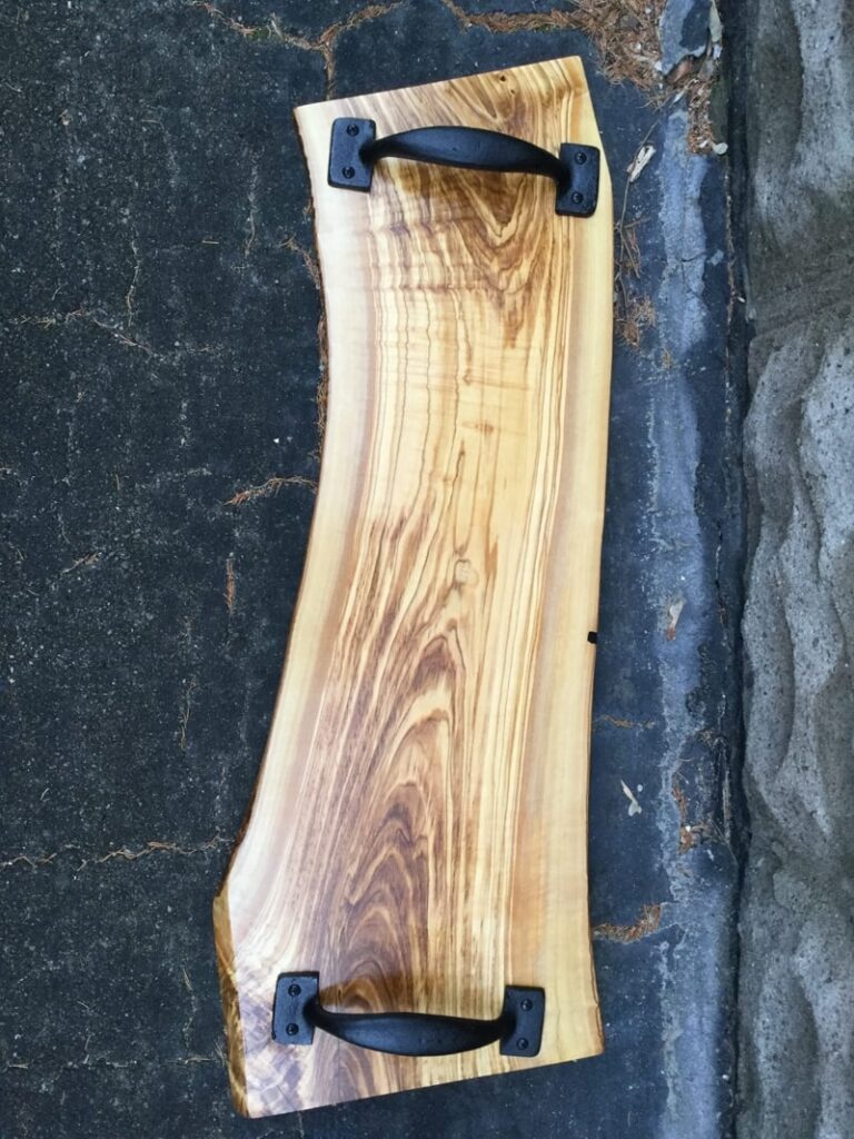 Olivewood and cast iron handle charcuterie board